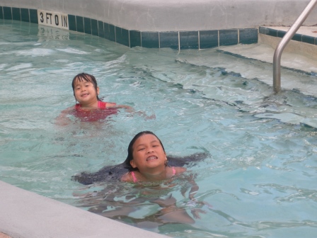 Kasen and Karis swimming in the lazy river